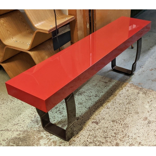 323 - DECCA BENCH, red lacquer on shaped metal support, bears plaque, 150cm x 28cm x 46cm H.