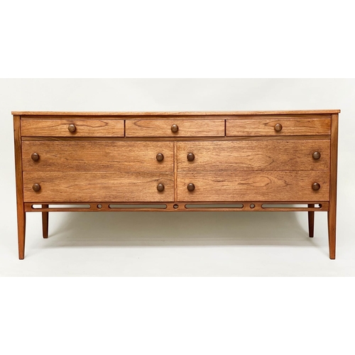 375 - LOW CHEST, mid 20th century teak with seven drawers in the manner of Heals, 148cm x 69cm H x 46cm.