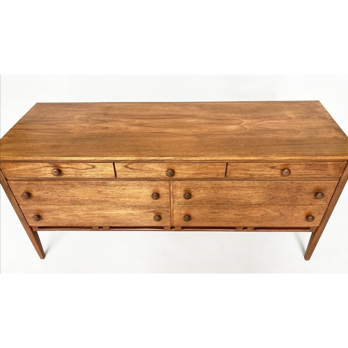 375 - LOW CHEST, mid 20th century teak with seven drawers in the manner of Heals, 148cm x 69cm H x 46cm.