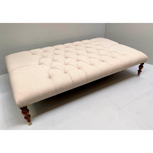 467 - HEARTH STOOL, 152cm x 92cm x 38cm, deep buttoned neutral upholstery, turned feet.