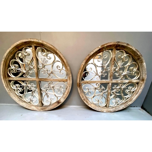 472 - ARCHITECTURAL CIRCULAR WALL MIRRORS, a pair, 72cm diameter, 5cm deep, aged frames. (2)