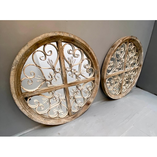 472 - ARCHITECTURAL CIRCULAR WALL MIRRORS, a pair, 72cm diameter, 5cm deep, aged frames. (2)