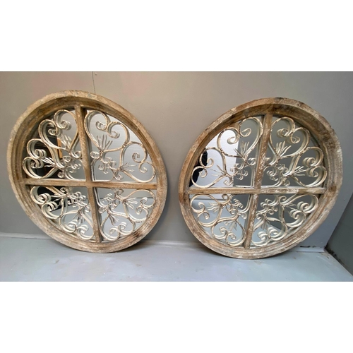 472 - ARCHITECTURAL CIRCULAR WALL MIRRORS, a pair, 72cm diameter, 5cm deep, aged frames. (2)