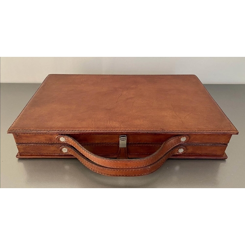 481 - BACKGAMMON SET, in leathered case, 7cm x 23cm x 40cm.