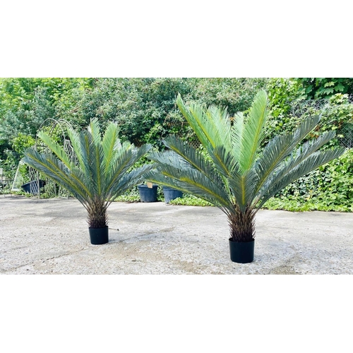 489 - FAUX FERN TREES, a pair, potted, 110cm high, 100cm wide. (2)