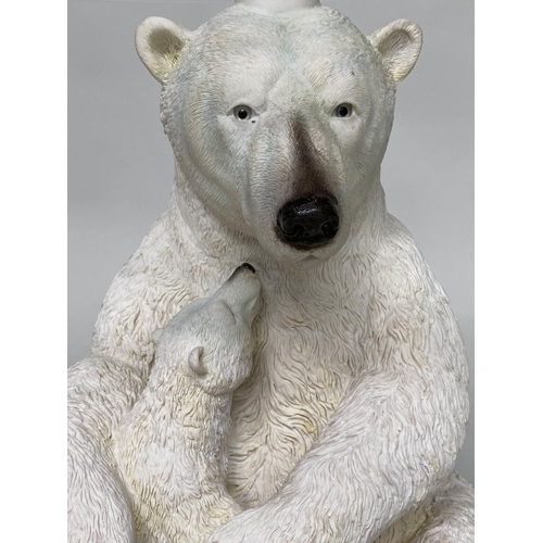 506 - POLAR BEAR TABLE, circular glazed on polar bear and cub support, 47cm W x 52cm H.