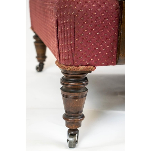 531 - ARMCHAIR, 88cm H x 64cm W, Victorian walnut, circa 1875, in maroon fabric on steel castors.