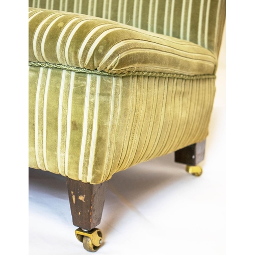 533 - LOW BANQUETTE, striped green velvet on brass castors, 72cm H x 110cm.