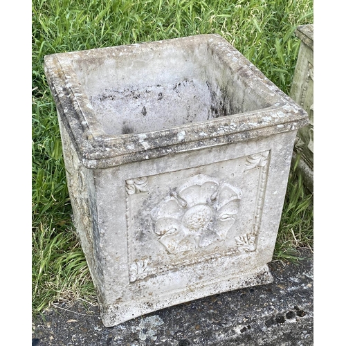 553 - PLANTERS, a pair, weathered composite stone, each square with rosette panelled side, 40cm x 40cm x 4... 