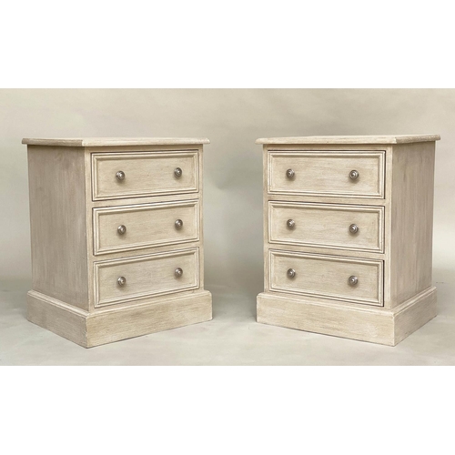 556 - BEDSIDE CHESTS, a pair, traditionally grey painted each with three drawers, 57cm W x 40cm D x 60cm H... 