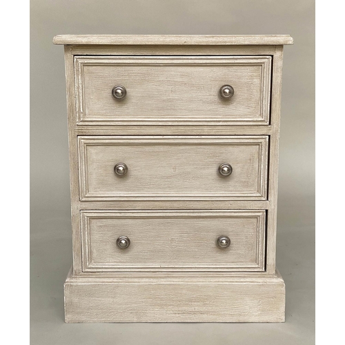 556 - BEDSIDE CHESTS, a pair, traditionally grey painted each with three drawers, 57cm W x 40cm D x 60cm H... 