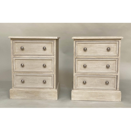 556 - BEDSIDE CHESTS, a pair, traditionally grey painted each with three drawers, 57cm W x 40cm D x 60cm H... 