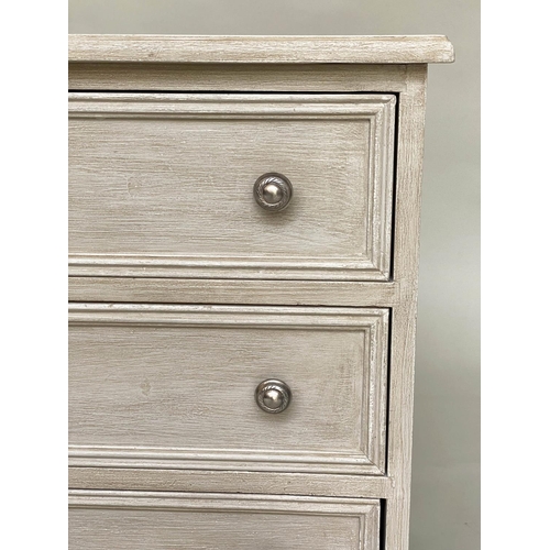 556 - BEDSIDE CHESTS, a pair, traditionally grey painted each with three drawers, 57cm W x 40cm D x 60cm H... 