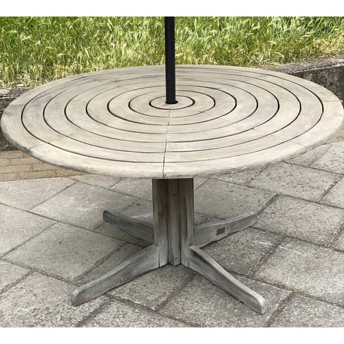 107 - CIRCULAR GARDEN TABLE, weathered teak with circular concentric slatted top and centre column support... 