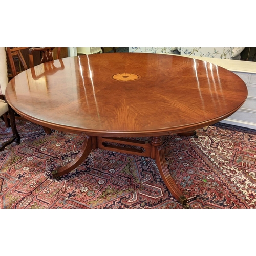 179 - BEVAN FUNNELL EXTENDING DINING TABLE, Georgian style mahogany with six extra leaves on brass castors... 