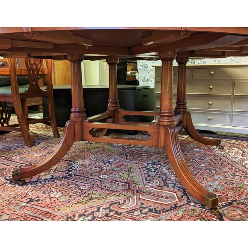 179 - BEVAN FUNNELL EXTENDING DINING TABLE, Georgian style mahogany with six extra leaves on brass castors... 