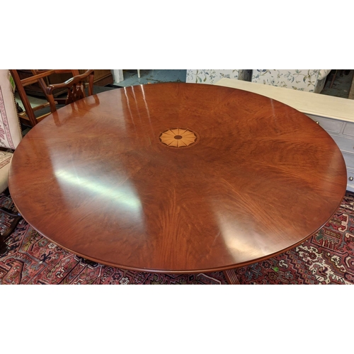 179 - BEVAN FUNNELL EXTENDING DINING TABLE, Georgian style mahogany with six extra leaves on brass castors... 