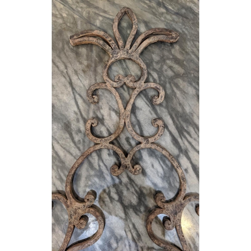 18 - WALL SCONCES, each 52cm H x 31cm W, iron a set of four in an antiqued finish.