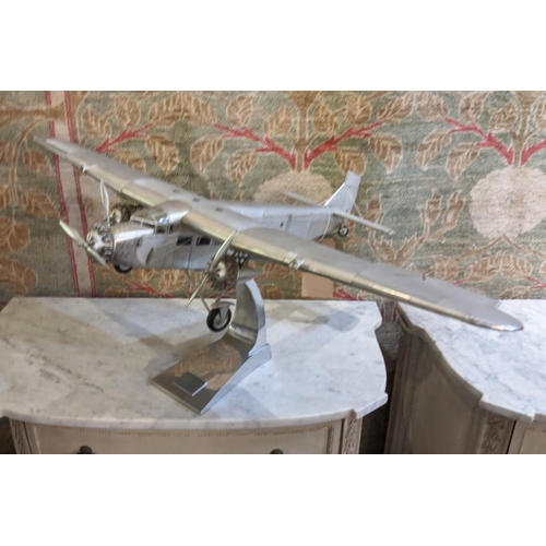 3 - FORD TRIMOTOR MODEL PLANE, aluminium, 1926 design, hand built to approximate scale, raised on stand,... 