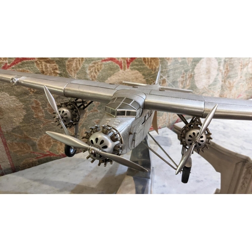 3 - FORD TRIMOTOR MODEL PLANE, aluminium, 1926 design, hand built to approximate scale, raised on stand,... 