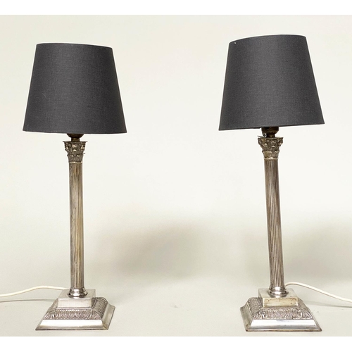 85 - TABLE LAMPS, a pair, silvered each with Corinthian capped reeded column with shades, 50cm H. (2)