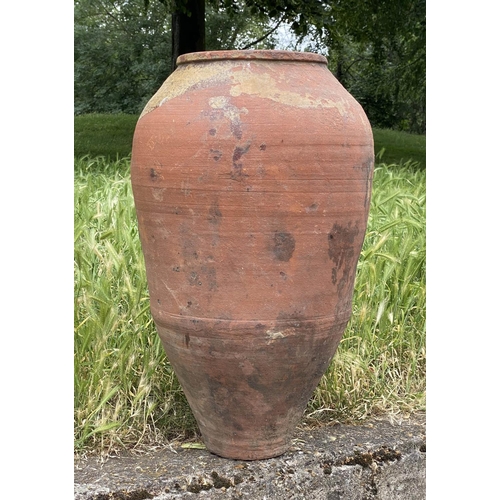 102 - GARDEN URN, weathered Mediterranean terracotta olive jar, 69cm H.