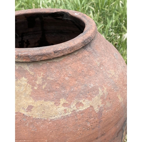 102 - GARDEN URN, weathered Mediterranean terracotta olive jar, 69cm H.