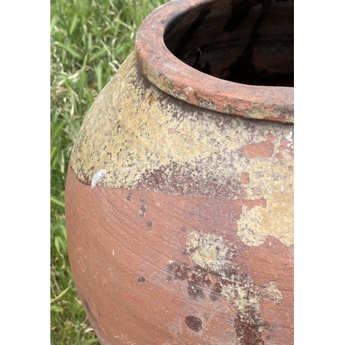 102 - GARDEN URN, weathered Mediterranean terracotta olive jar, 69cm H.