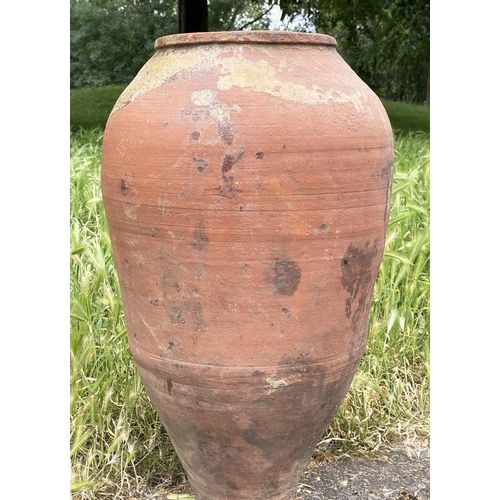 102 - GARDEN URN, weathered Mediterranean terracotta olive jar, 69cm H.