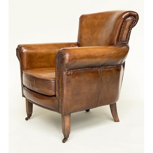 118 - ARMCHAIR, brass studded tan brown leather with rounded back and arms and tapering supports with cast... 