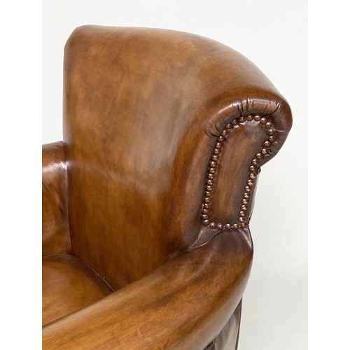 118 - ARMCHAIR, brass studded tan brown leather with rounded back and arms and tapering supports with cast... 