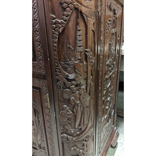 144 - CHINESE BAR, 104cm H x 91cm W 44cm D, with a rising lid and fall front heavily carved all over.