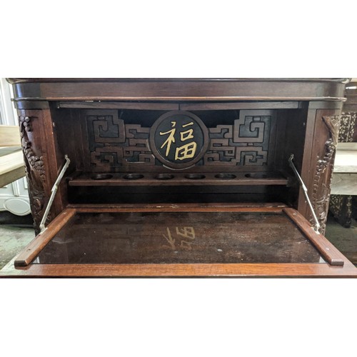 144 - CHINESE BAR, 104cm H x 91cm W 44cm D, with a rising lid and fall front heavily carved all over.