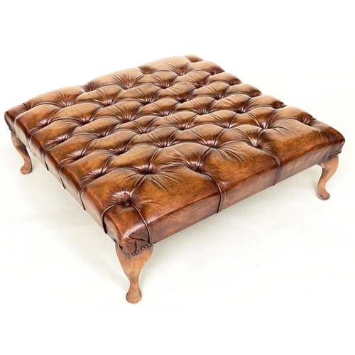 117 - CENTRE STOOL, large rectangular deep buttoned tan brown leather, brass studded and with shaped suppo... 