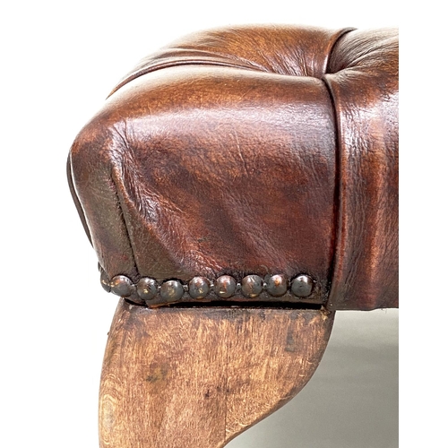 117 - CENTRE STOOL, large rectangular deep buttoned tan brown leather, brass studded and with shaped suppo... 