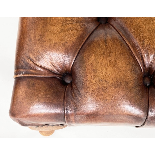 117 - CENTRE STOOL, large rectangular deep buttoned tan brown leather, brass studded and with shaped suppo... 