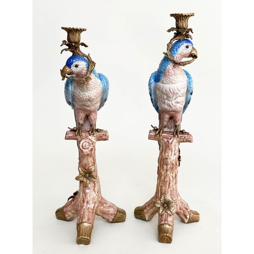 119 - PARROT CANDLESTICKS, a pair, Continental style painted porcelain and gilt metal mounted, 51cm H. (2)
