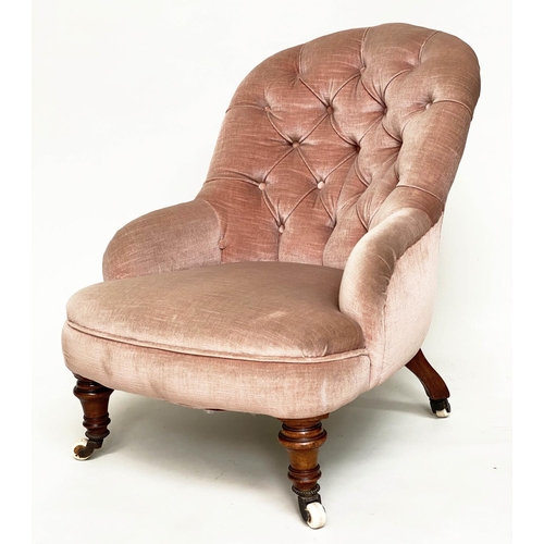 121 - SLIPPER ARMCHAIR, Victorian walnut with faded rose pink velvet buttoned upholstery, and turned front... 