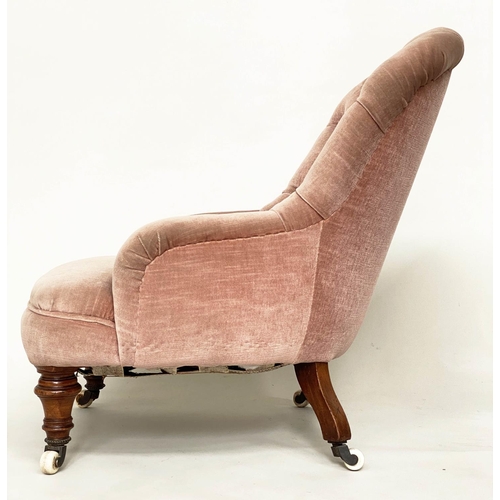 121 - SLIPPER ARMCHAIR, Victorian walnut with faded rose pink velvet buttoned upholstery, and turned front... 