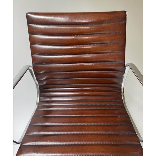 86 - REVOLVING DESK CHAIR, Charles and Ray Eames inspired, with ribbed tan leather seat revolving and rec... 