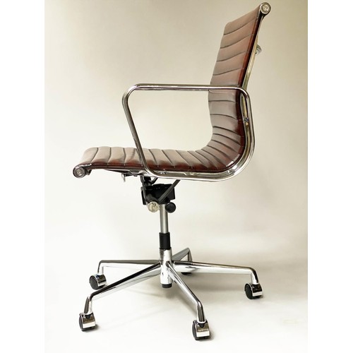 86 - REVOLVING DESK CHAIR, Charles and Ray Eames inspired, with ribbed tan leather seat revolving and rec... 