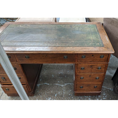 132 - PEDESTAL DESK, 76cm H x 120cm W x 64cm D, Victorian oak with green leather top and nine drawers on c... 