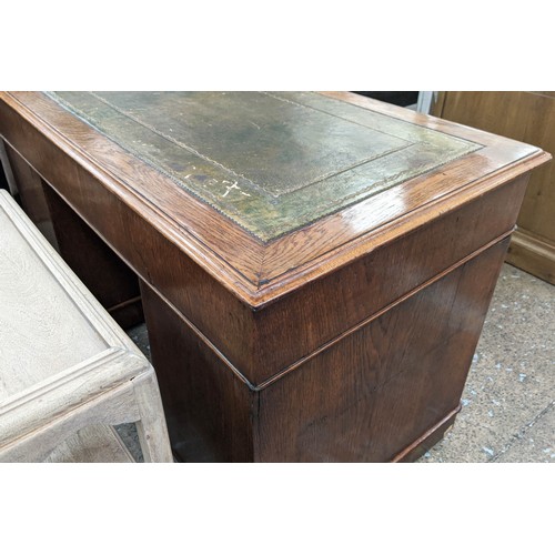 160 - PEDESTAL DESK, 76cm H x 120cm W x 64cm D, Victorian oak with green leather top and nine drawers on c... 