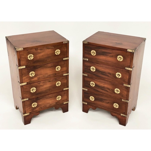 122 - CAMPAIGN STYLE BEDSIDE CHESTS, a pair, campaign style mahogany and brass bound each with four drawer... 