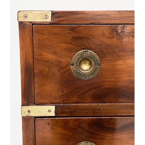 122 - CAMPAIGN STYLE BEDSIDE CHESTS, a pair, campaign style mahogany and brass bound each with four drawer... 