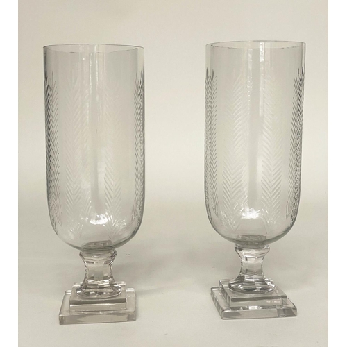 140 - STORM LANTERNS, a pair, etched cut glass cylindrical with stepped base, 40cm H. (2)