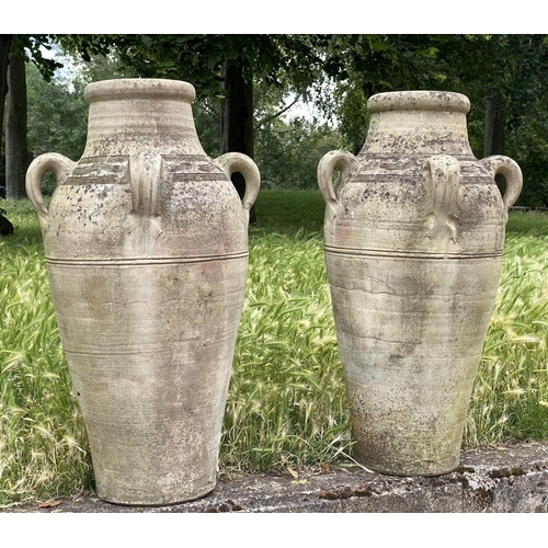 143 - GARDEN OLIVE JARS, a pair, weathered reconstituted stone of olive jar tapering form, 79cm H. (2)