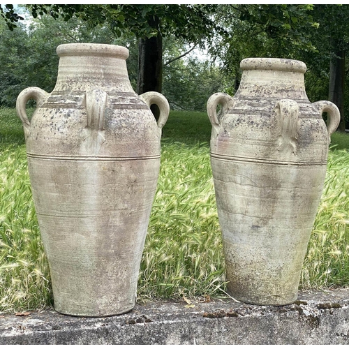 143 - GARDEN OLIVE JARS, a pair, weathered reconstituted stone of olive jar tapering form, 79cm H. (2)