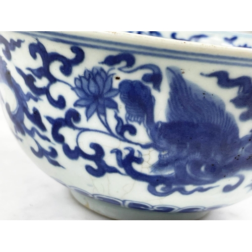 23 - BOWL, Chinese blue and white, decorated with repeat dragon pattern and chrysanthemums, 18cm diam x 9... 