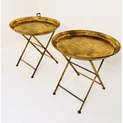 471 - SIDE TABLES, a pair, aged gilt finished metal, folding design, 66cm x 66cm x 66cm.